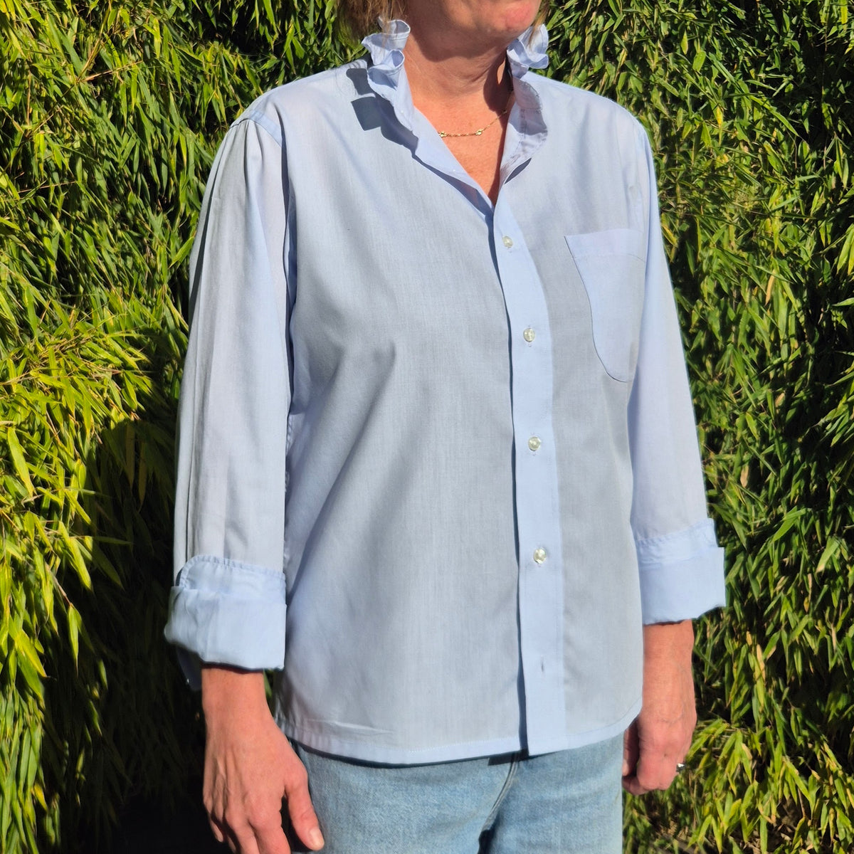 Pale blue shirt with ruffle collar : size M