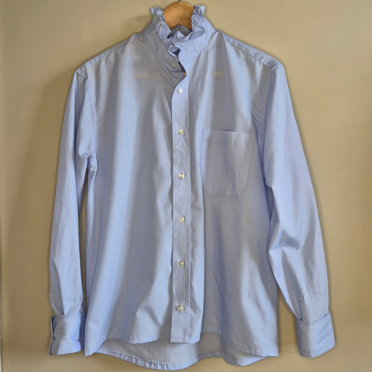 Pale blue shirt with ruffle collar : size M