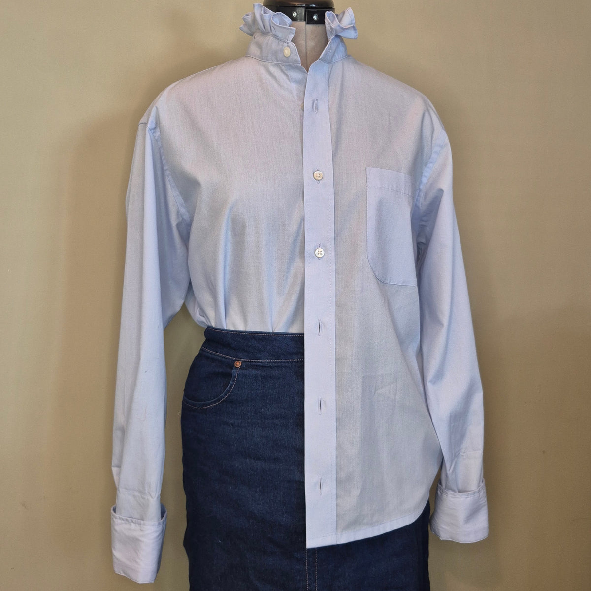 Pale blue shirt with ruffle collar : size M